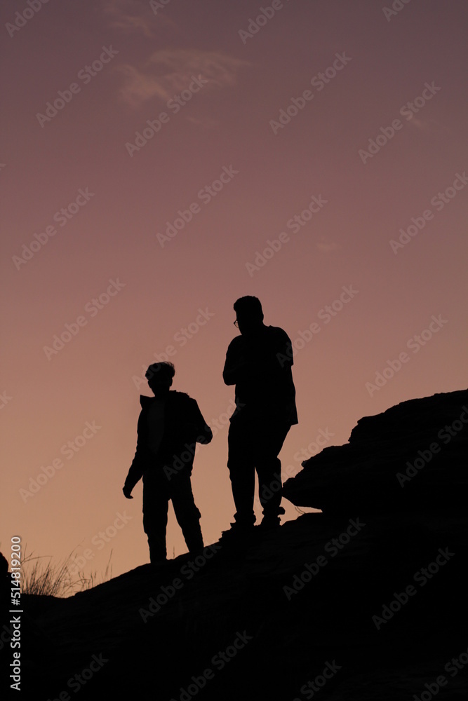 silhouette of a family at sunset silhouette of a family at sunset
