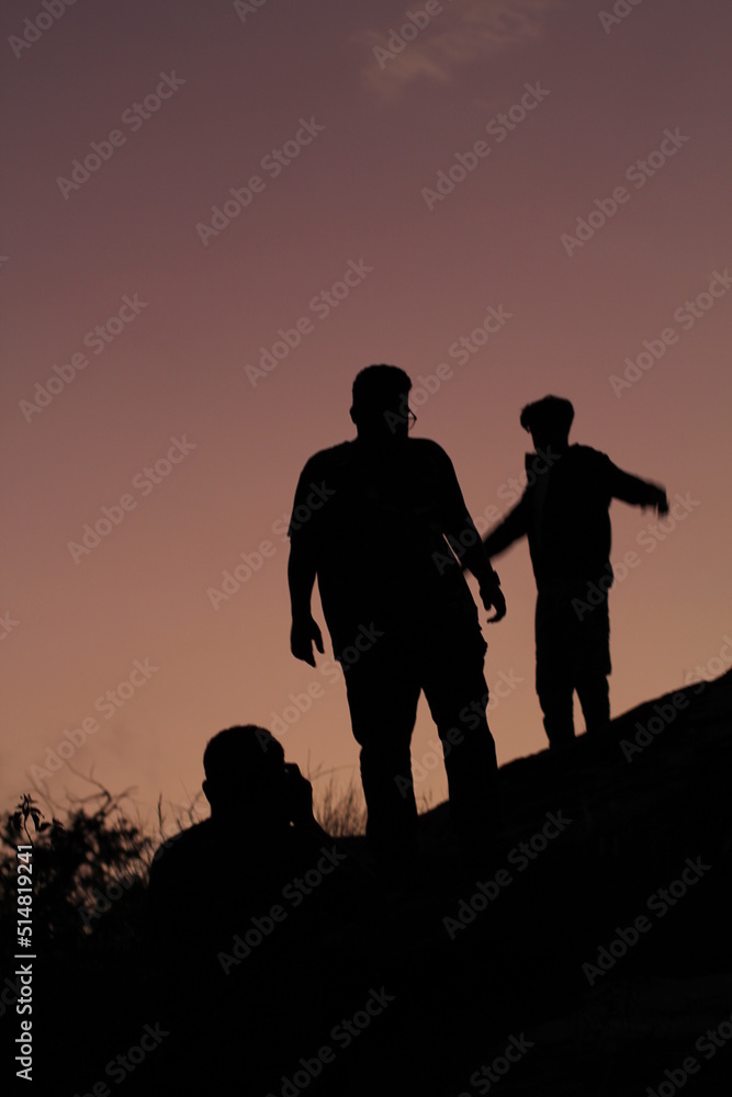 silhouette of two people