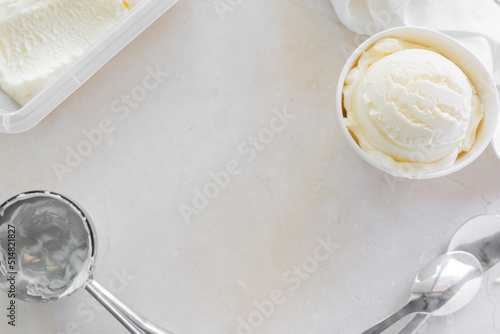 Fototapeta Naklejka Na Ścianę i Meble -  Vanilla ice cream in white cup, marble background