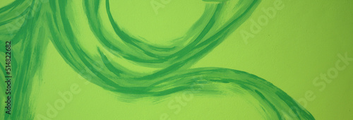 floral pattern painted on the wall, green abstract crooked shape on green light background, green wallpaper