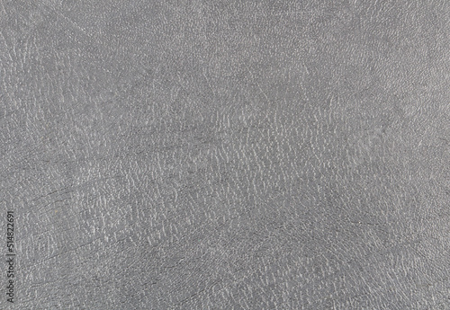 Gray background with scratched texture.