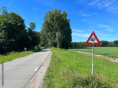 Snake sign next to a road through the kuinderbos photo