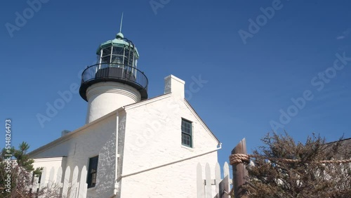 Wallpaper Mural Vintage lighthouse tower, retro light house, old fashioned historic classic white beacon, fresnel lens. Nautical navigational coastal building, picket fence,1855. Point Loma, San Diego, California USA Torontodigital.ca