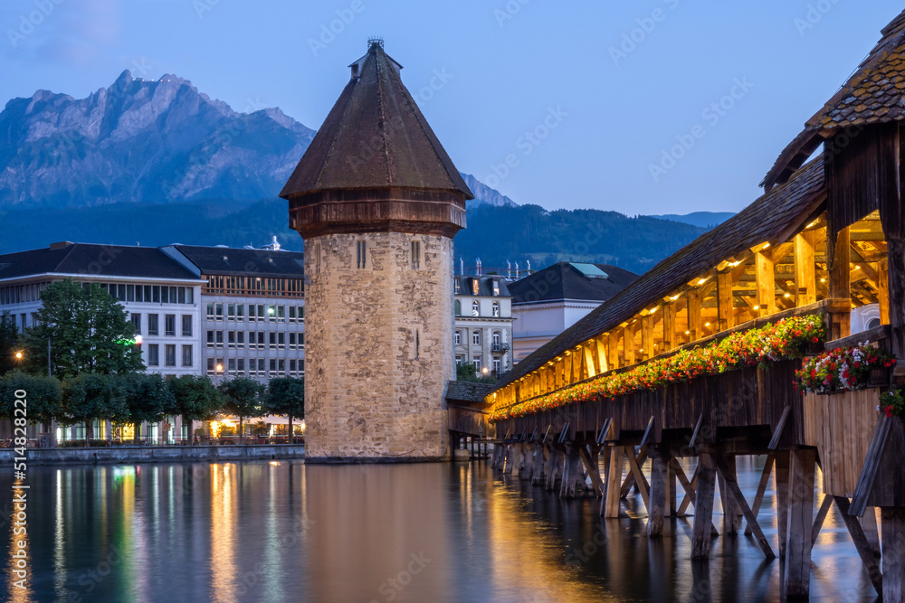 Lucerne in. twilight, Switzerland. Historic city center with its famous Chapel Bridge and Mt. Lucerne in. twilight, Switzerland. Historic city center with its famous Chapel Bridge and Mt.