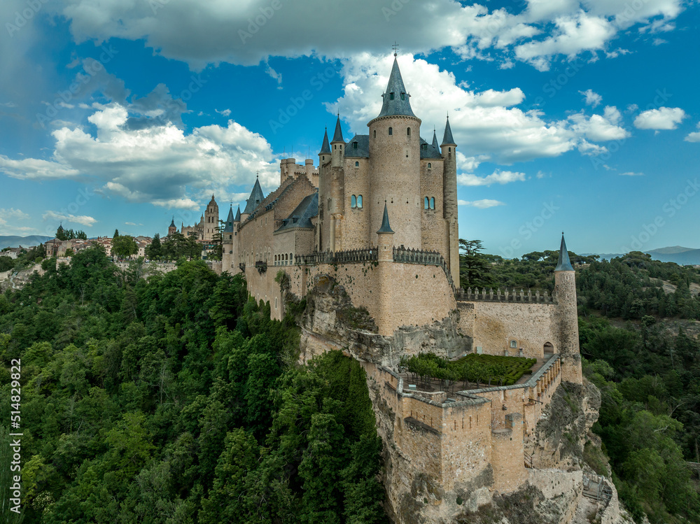 Aerial view of the Alcazar of Segovia world famous medieval stronghold and palace of the Spanish kings with blue cloudy sky