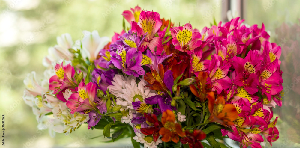 a large bouquet of multi-coloured alstroemerias a large bouquet of multi-coloured alstroemerias
