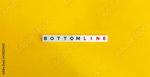 Bottom Line Text on Letter Tiles on Yellow Background. Minimal Aesthetics. photo
