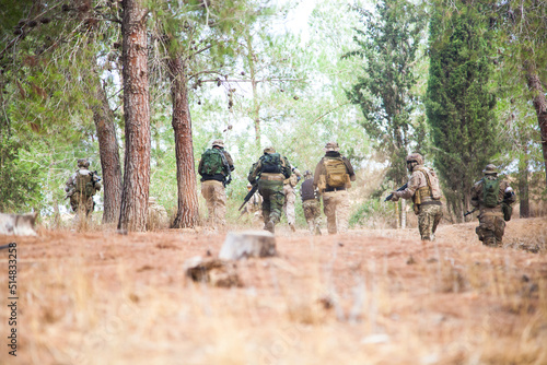 Photography A group of military guys runs in the forest