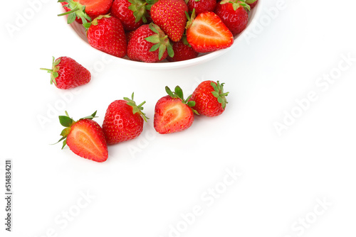 Red ripe strawberry in the white bowl