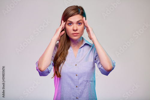Woman with headache touching her head. business woman isolated portrait.