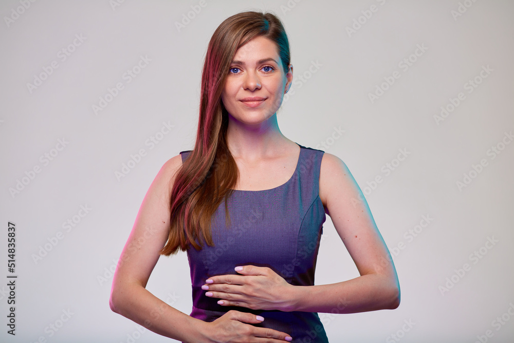 Smiling woman with hands on stomach, isolated portrait. photo with color filter. Smiling woman with hands on stomach, isolated portrait. photo with color filter.