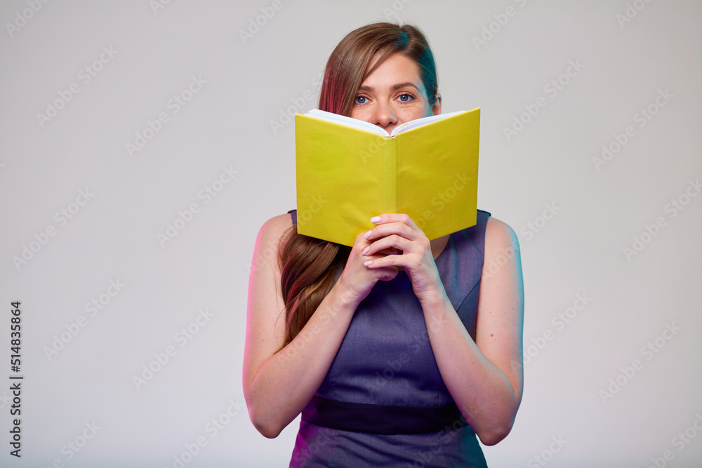 Teacher or smiling woman adult student holding open yellow book in front of, isolated portrait. Teacher or smiling woman adult student holding open yellow book in front of, isolated portrait.