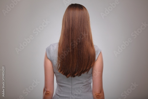 Isolated business woman back view portrait, business person, teacher or adult student with long hair.