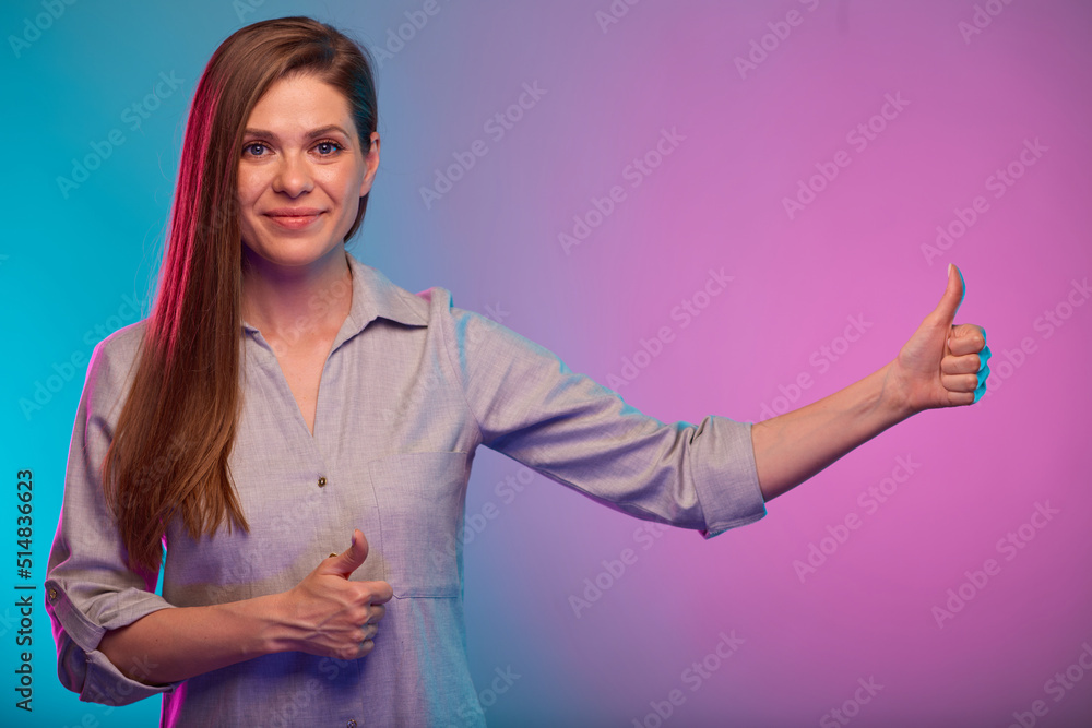 Business woman with thumb up, portrait with neon lights. Female model isolated on neon background. Business woman with thumb up, portrait with neon lights. Female model isolated on neon background.