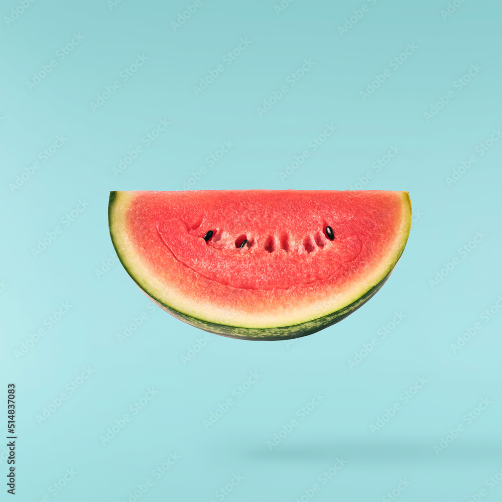 Fresh raw watermelon falling in the air isolated Fresh raw watermelon falling in the air isolated
