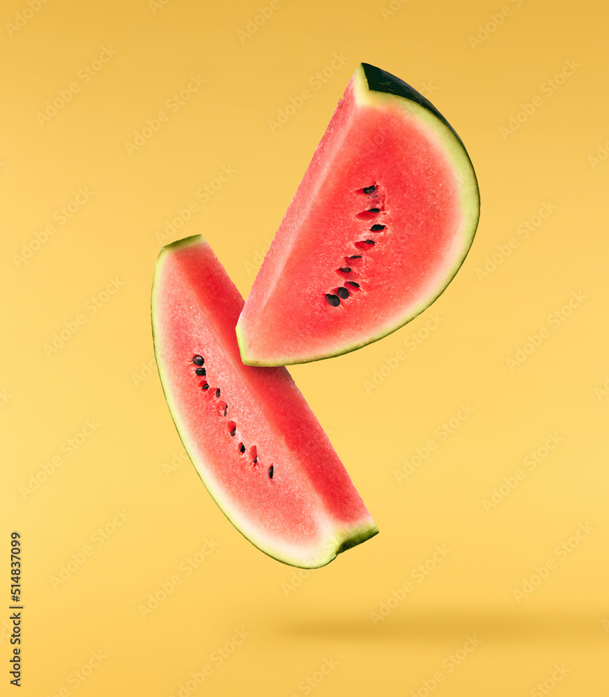 Fresh raw watermelon falling in the air isolated Fresh raw watermelon falling in the air isolated
