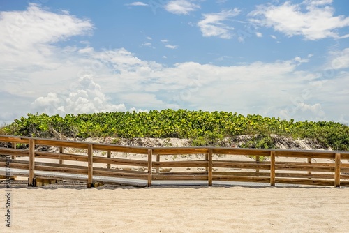 Sand dunes along the pier at a Florida beach