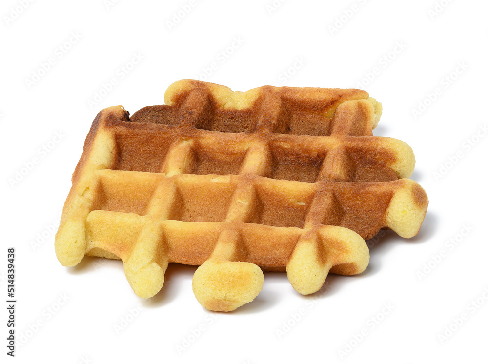 Baked Belgian waffle on a white isolated background Baked Belgian waffle on a white isolated background