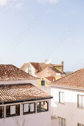 The sky and clay rooftops of homes and apartments in Portugal photo
