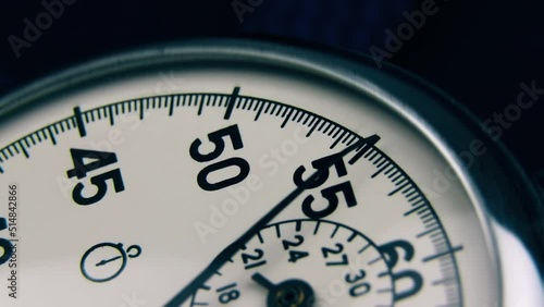 Analog stopwatch close-up. Counting time by stopwatch. Time measurement. Time management concept.A tool for measuring time.Dial stopwatch arrow.Selective focus. Countdown.  