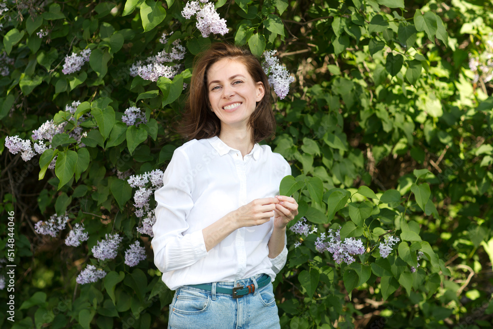 middle aged woman relaxed outdoors. copy space. Slow life. Enjoying the little things. spends time in nature in summer middle aged woman relaxed outdoors. copy space. Slow life. Enjoying the little things. spends time in nature in summer