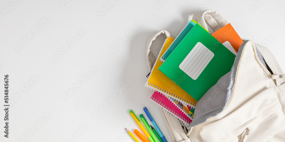 Backpack with colorful school supplies on white background. Back to ...