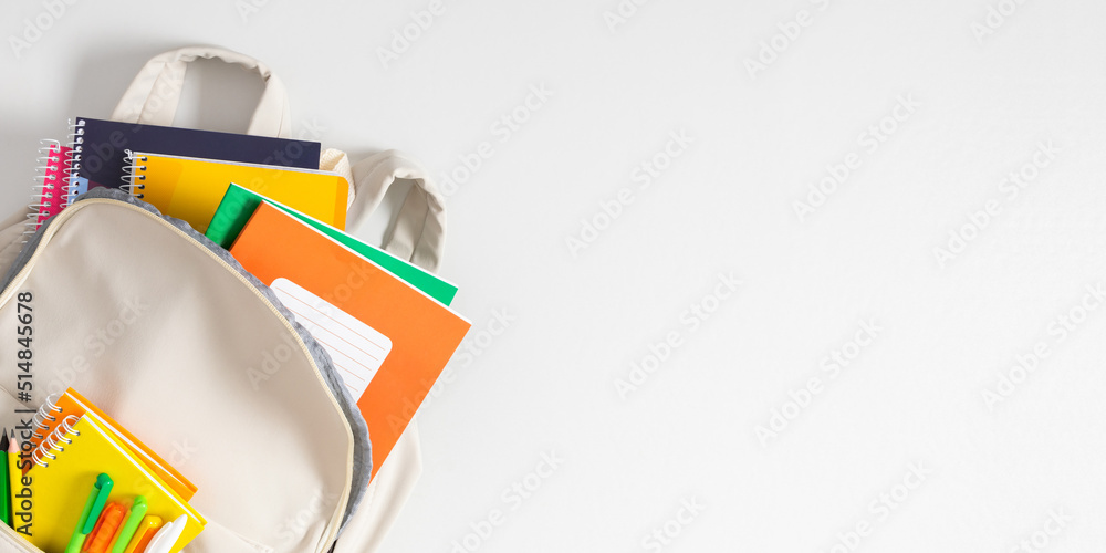 Backpack with colorful school supplies on white background. Back to ...