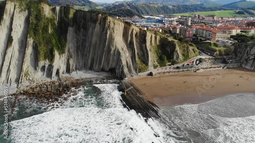 Aerial drone view of famous flysch of Zumaia, Basque Country, Spain. Flysch is a sequence of sedimentary rock layers that progress from deep-water photo