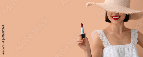 Fashionable woman in hat ho...