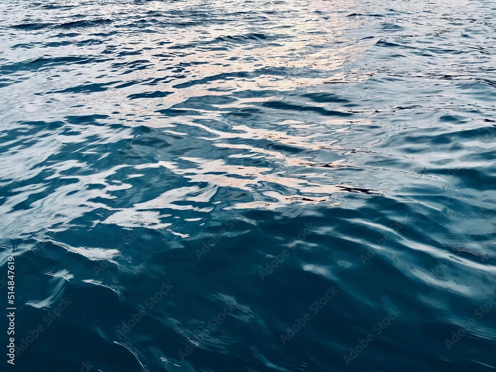 Fototapeta premium Rough deep turquoise sea background. Texture of water surface. Abstract watercolour background. Beautiful wave texture on the seashore. Watercolour textured backgrounds.