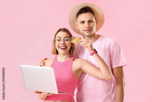 Young couple with laptop an...