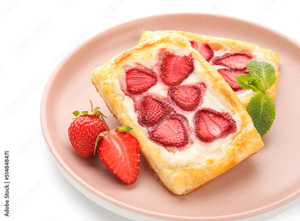Plate with strawberry puff pastries and mint leaves on white background Plate with strawberry puff pastries and mint leaves on white background