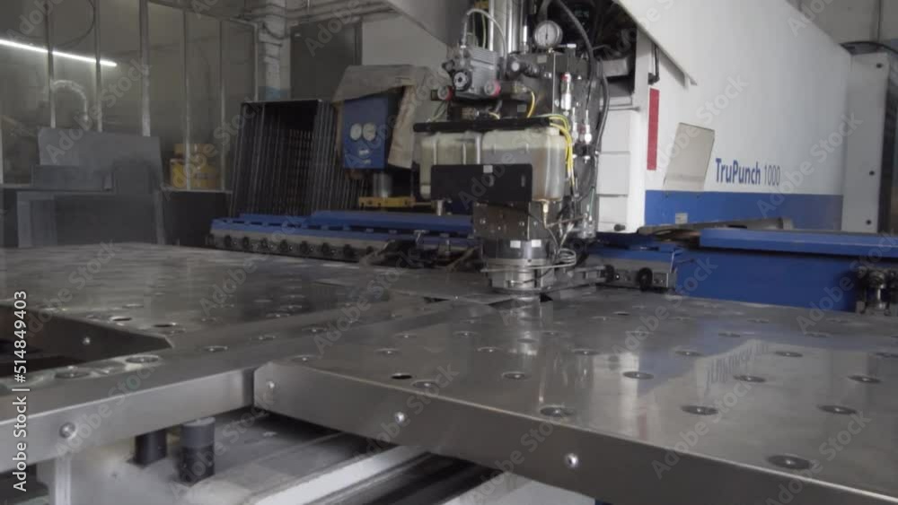 Automatic cnc hydraulic press bending machine working with sheet metal at factory, plant. Metalworking, industrial, equipment, technology, machining, manufacturing concept Automatic cnc hydraulic press bending machine working with sheet metal at factory, plant. Metalworking, industrial, equipment, technology, machining, manufacturing concept