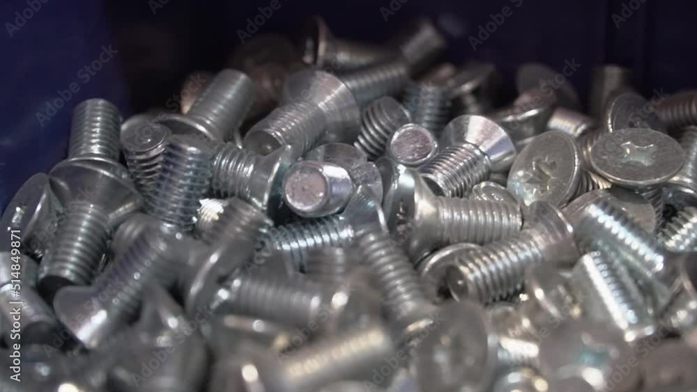 Many building screws. fasteners in a pile. The concept of specialized stores. Many building screws. fasteners in a pile. The concept of specialized stores.