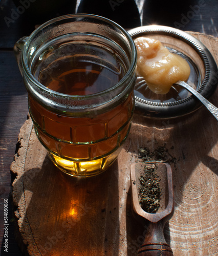 Healthy winter herbal tea with honey in vintage glass, cosy morning
