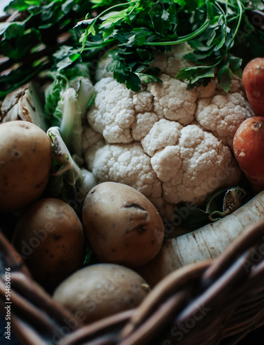 vegetables in wicker basket, potatoes, cauliflower, carrots, healthy food