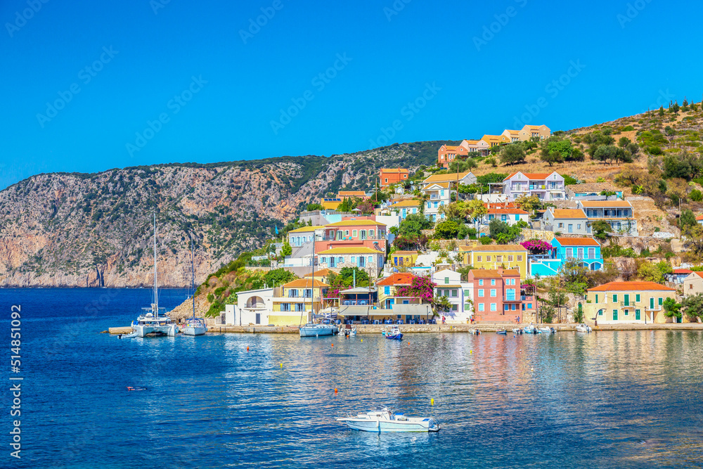 Colorful houses with yachts in Assos village on Kefalonia Island in Greece