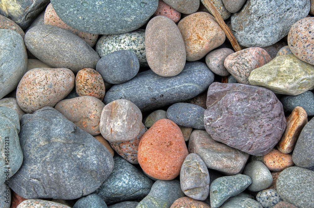 Beach rounded rocks in various colors from ocean Beach rounded rocks in various colors from ocean