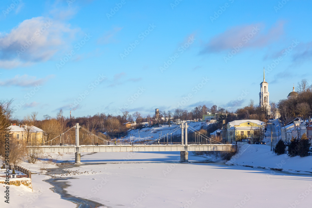 Fototapeta premium View of Torzhok city center with Tvertsa river, Russia. Russian winter landscape