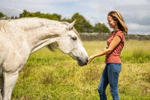 White Lusitano horse, friendship with woman, amazing connection.