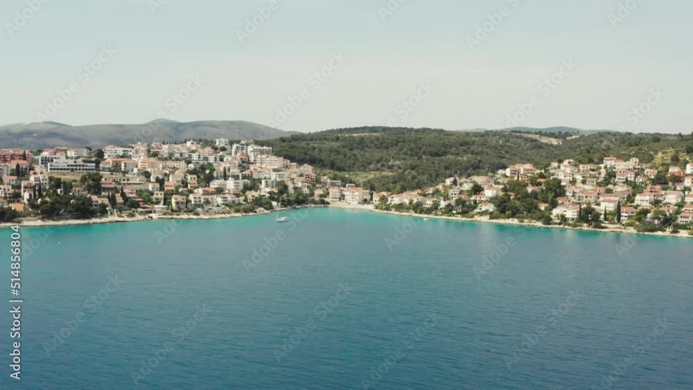 Aerial view of the tourist islands of Croatia. Beautiful landscape of the Adriatic sea and the city with beaches and houses on the slopes of the mountains. Aerial view of the tourist islands of Croatia. Beautiful landscape of the Adriatic sea and the city with beaches and houses on the slopes of the mountains.