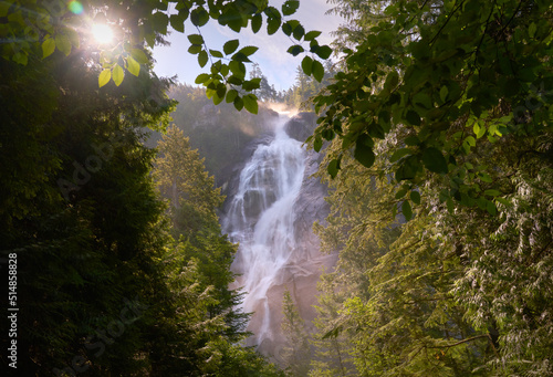Shannon Falls Sunburst Squamish BC. Thundering Shannon Falls and the sun bursting through the trees. Located near Squamish north of Vancouver. British Columbia, Canada. 

