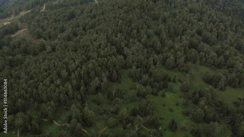 Deep green forest on mountains of Manzherok, Altai, Siberia, Russia. Beautiful summer nature landscape at during daytime. Aerial view from a drone Deep green forest on mountains of Manzherok, Altai, Siberia, Russia. Beautiful summer nature landscape at during daytime. Aerial view from a drone