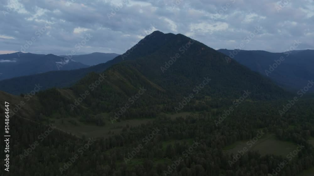 Aerial of majestic mountains in valley of Altai under sunset sky, Siberia, Russia. Beautiful summer nature landscape at during sunset. Aerial view from a drone Aerial of majestic mountains in valley of Altai under sunset sky, Siberia, Russia. Beautiful summer nature landscape at during sunset. Aerial view from a drone