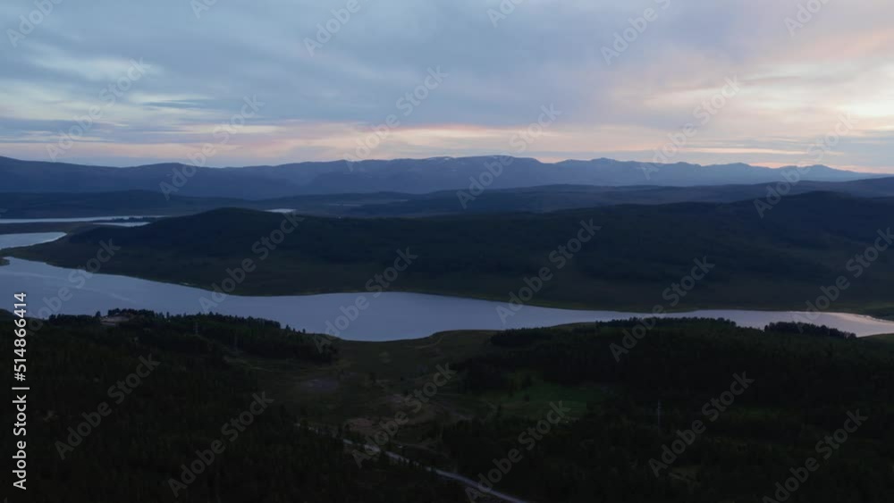 Aerial view on lakes and mountains with dramatic sky in Altai in evening time, Siberia, Russia. Beautiful summer nature landscape at during daytime Aerial view on lakes and mountains with dramatic sky in Altai in evening time, Siberia, Russia. Beautiful summer nature landscape at during daytime