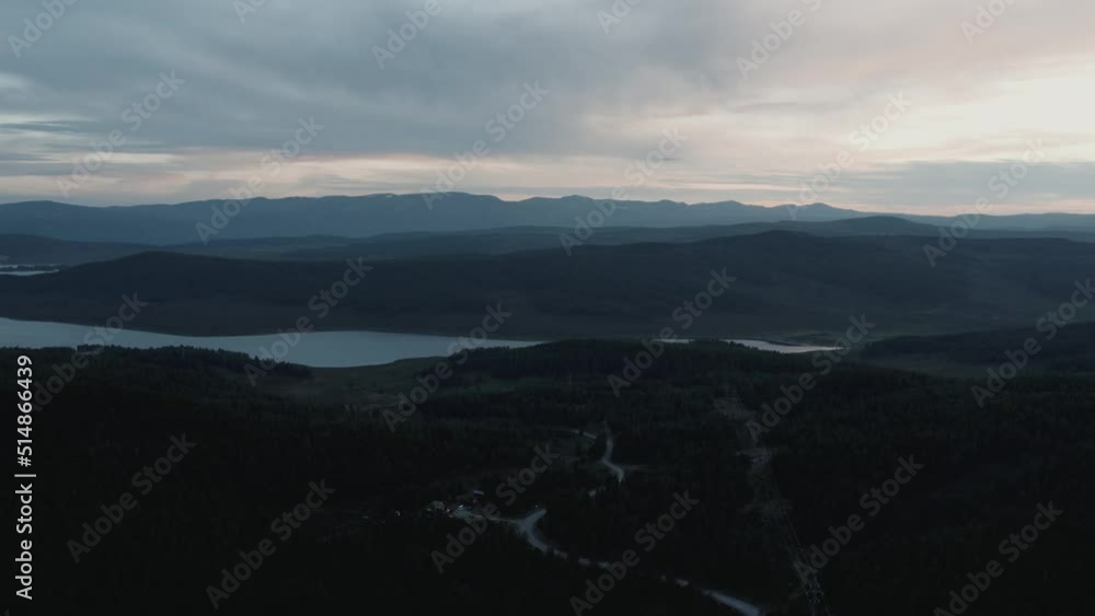 Aerial view on lakes and mountains with dramatic sky in Altai in evening time, Siberia, Russia. Beautiful summer nature landscape at during daytime Aerial view on lakes and mountains with dramatic sky in Altai in evening time, Siberia, Russia. Beautiful summer nature landscape at during daytime