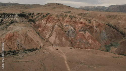 Kyzyl-Chin valley with red mountains also called as Mars valley in Altai, Siberia, Russia. Beautiful summer nature landscape at during daytime. Aerial view from a drone