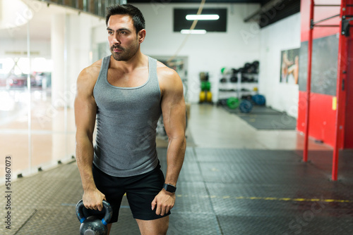 Young man working out with weights