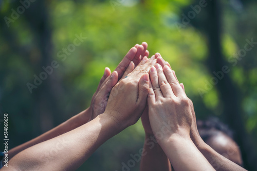 Diversity multiethnic high five group of business people success team hands together. Collaborate Volunteer friendship hands raise up mission Business partner. Group of teamwork high five together