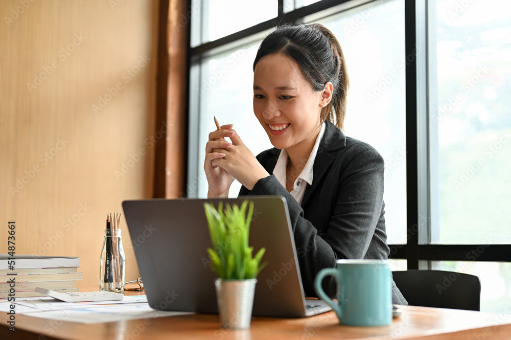 Businesswoman or female company worker working on her project via laptop. Businesswoman or female company worker working on her project via laptop.